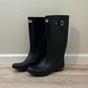 Black tall Hunter rain boots